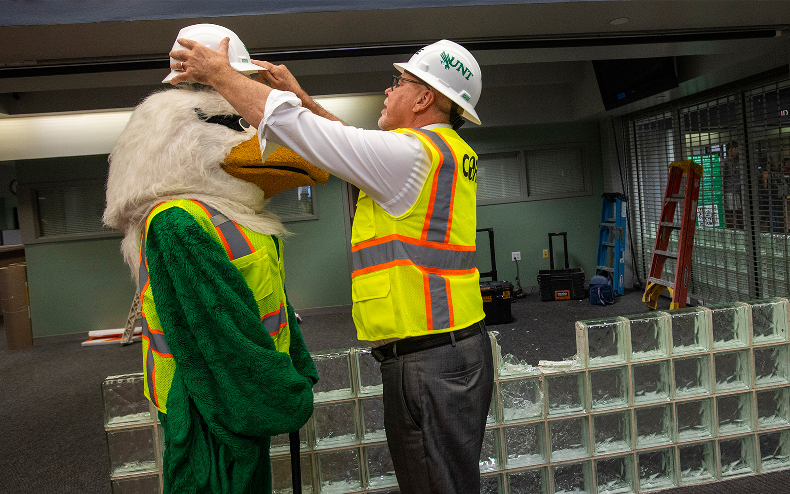 UNT President Smatresk and Scrappy stand ready to start renovation.